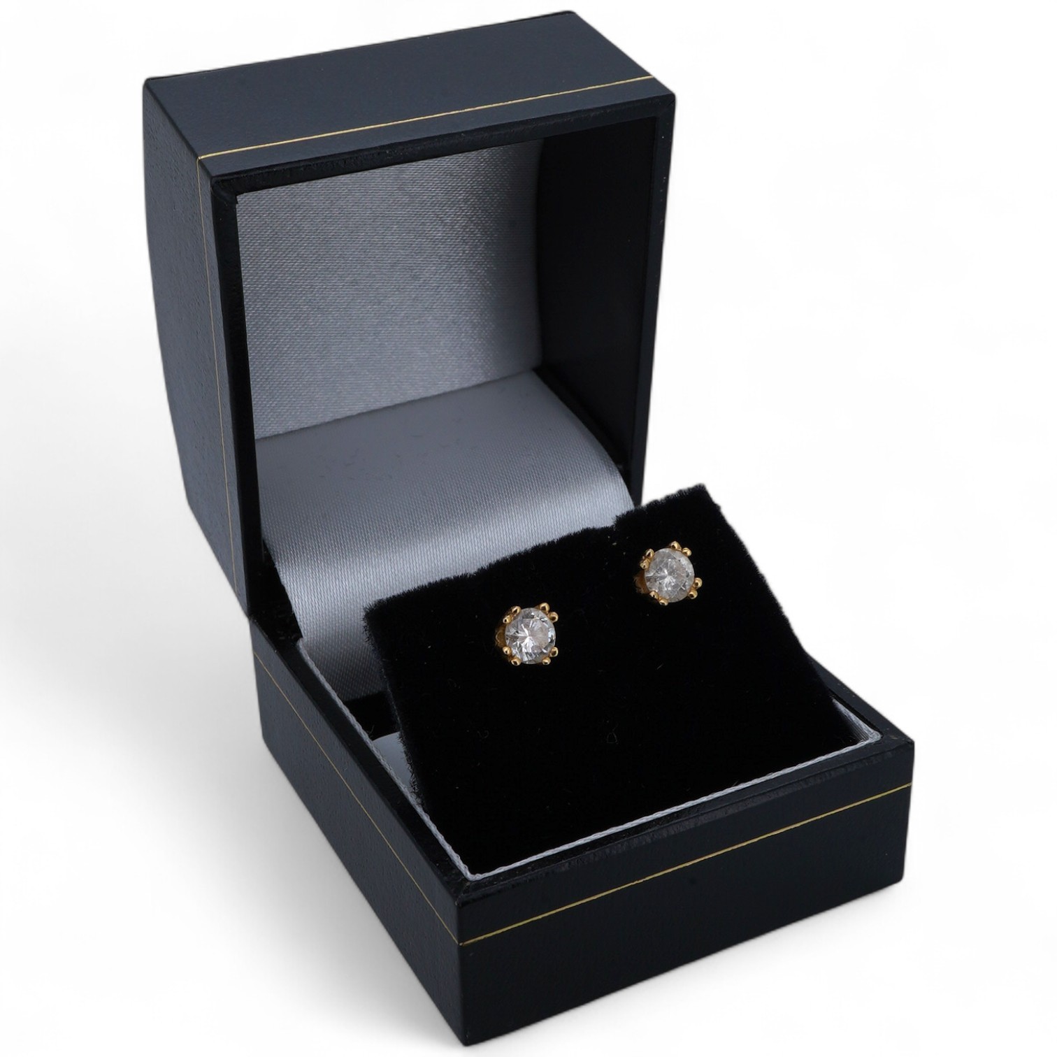 A pair of diamond ear studs, each weighing approximately 0.30 carats, mounted in gold, approximately 4.5mm diameter